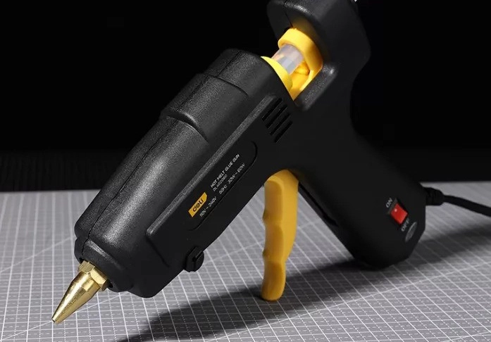 What is a hot melt glue gun used for?