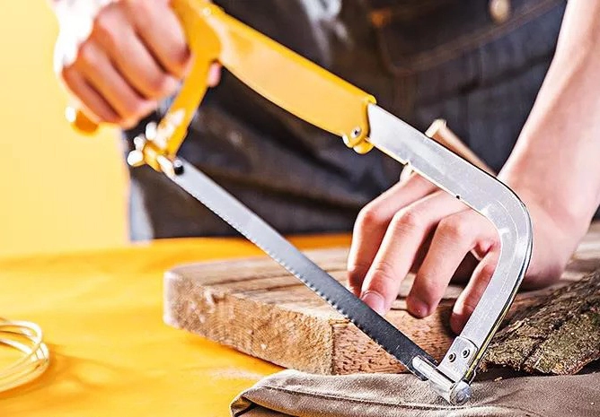 What are the precautions for using a hacksaw?